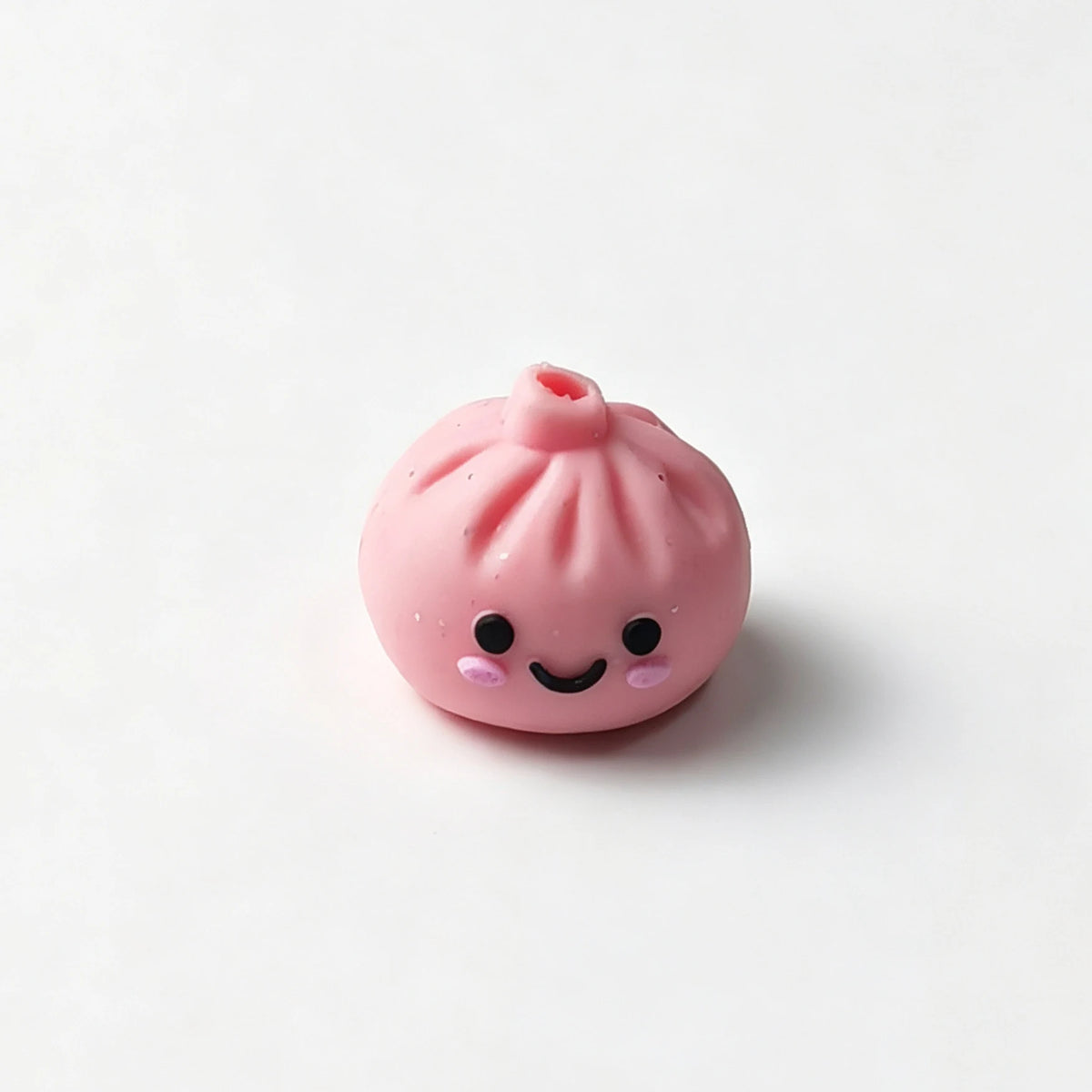 Pink bao bun silicone focal bead with a smiling face