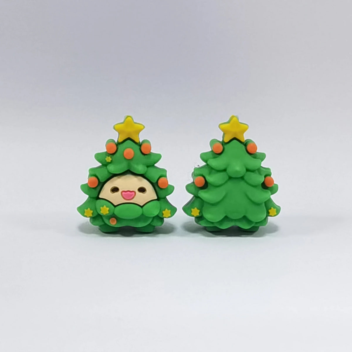 Christmas Tree - Smiling Face silicone focal bead design on a pale background