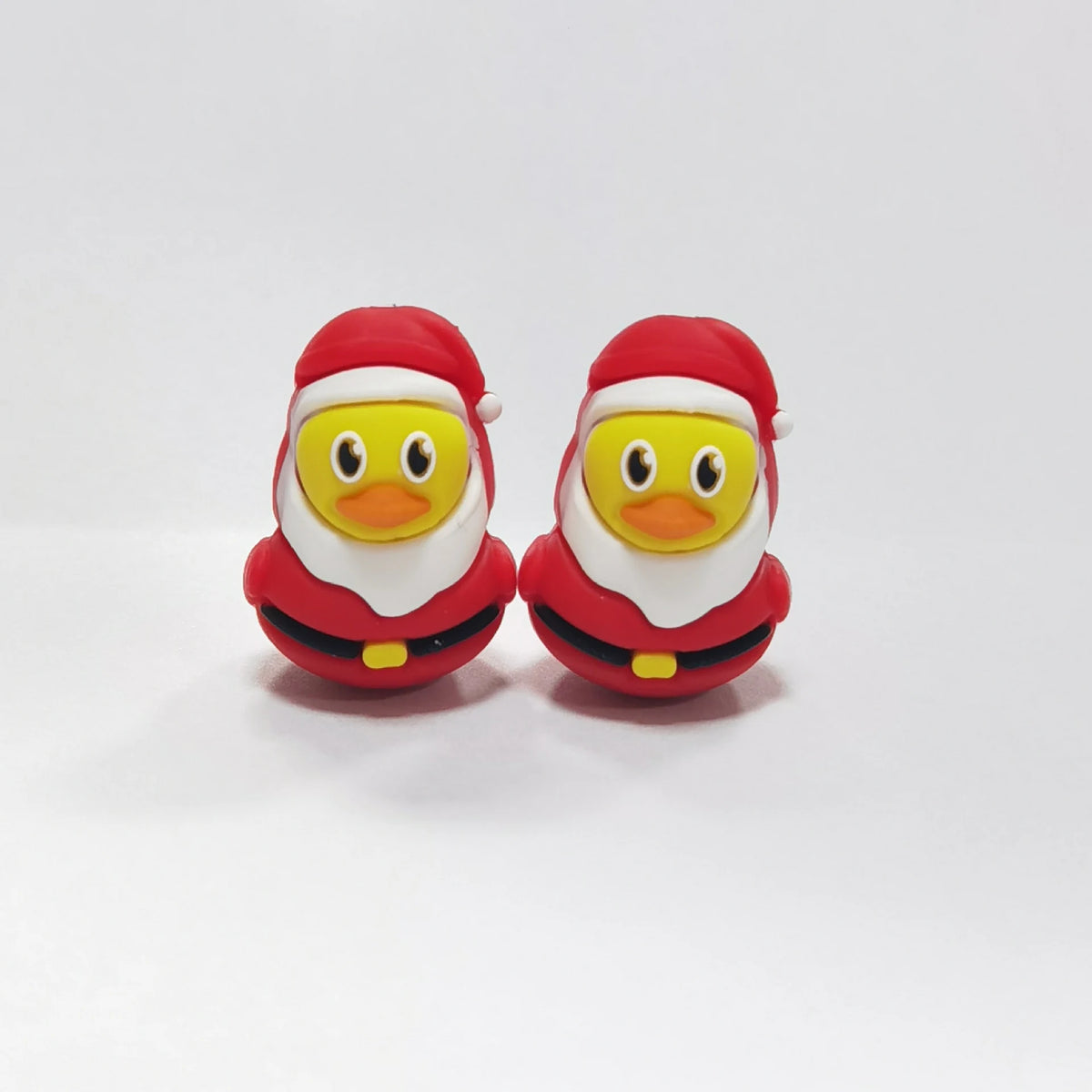 Duck - Santa Outfit silicone focal bead design on a pale background