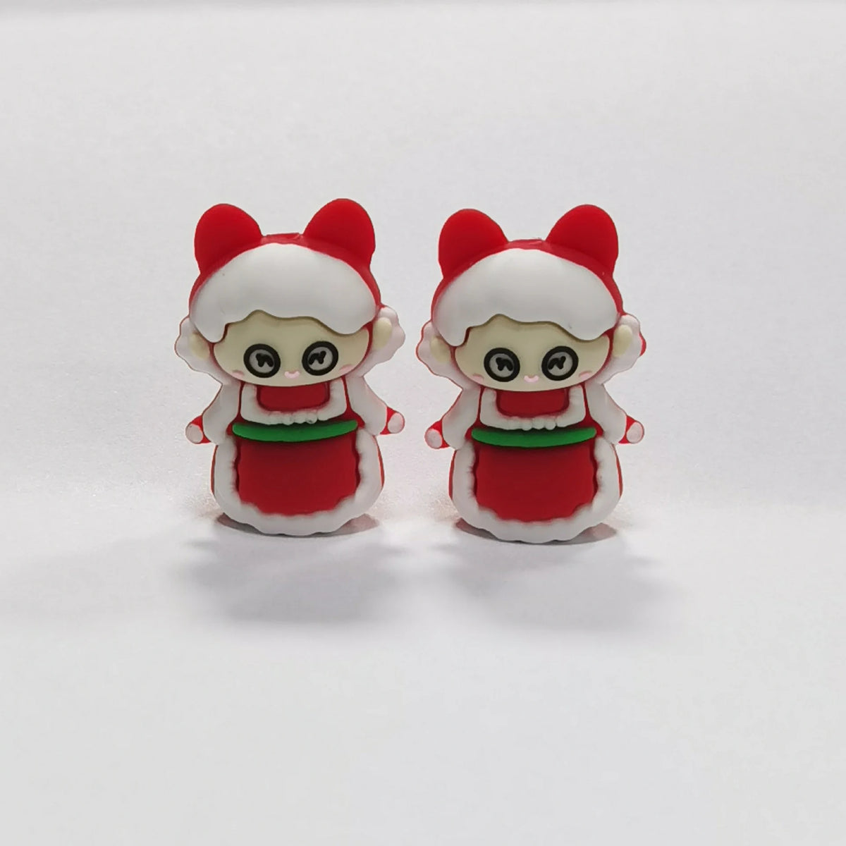 Holiday Character - Red Bow silicone focal bead design on a pale background