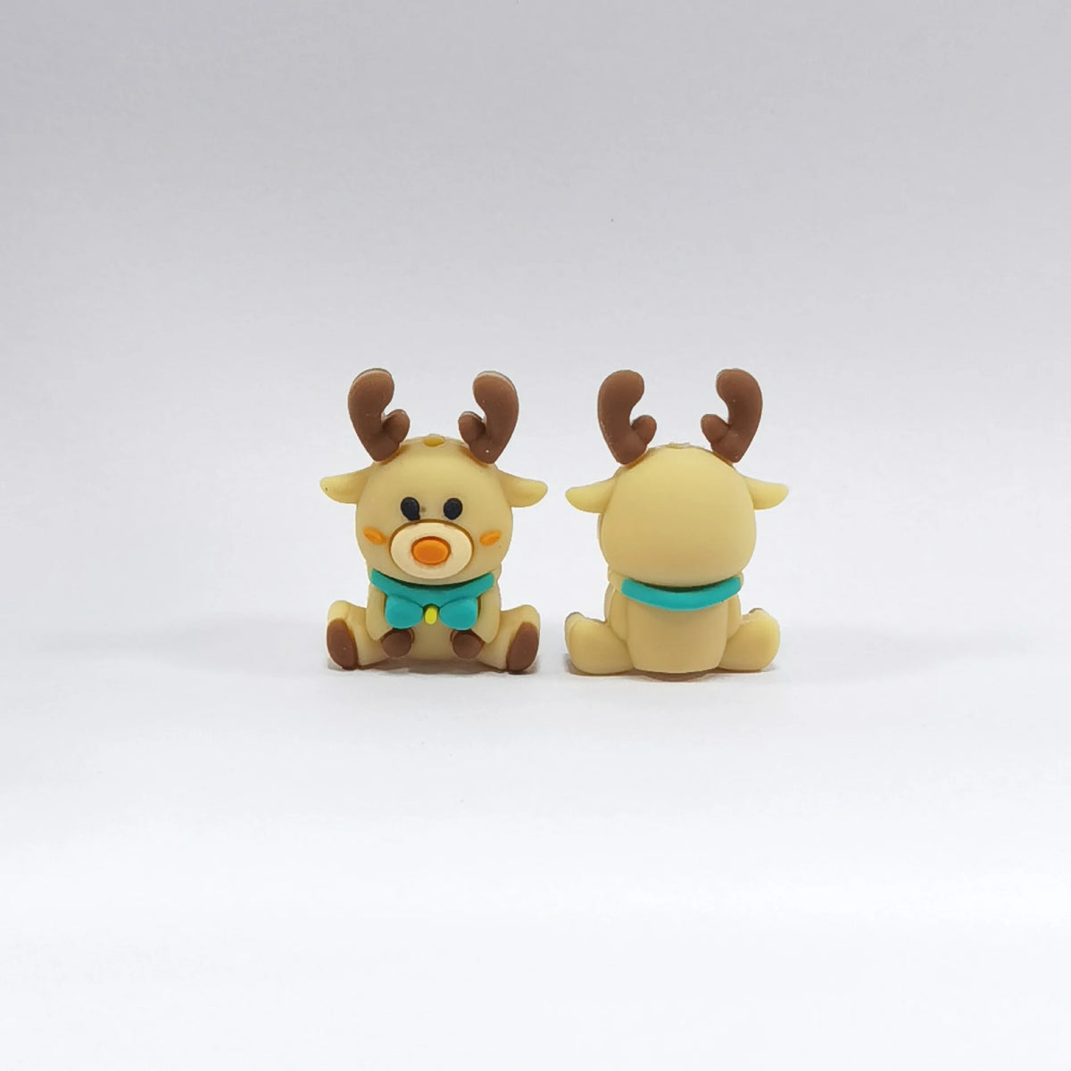 Reindeer - Teal Bow silicone focal bead design on a pale background