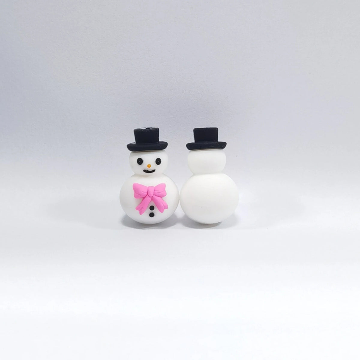 Snowman - Pink Bow silicone focal bead design on a pale background
