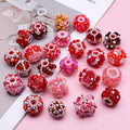 Red acrylic focal bead assortment with floral details, rhinestones and pearl-effect accents