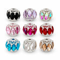 Example assortment of filigree focal beads in nine colors