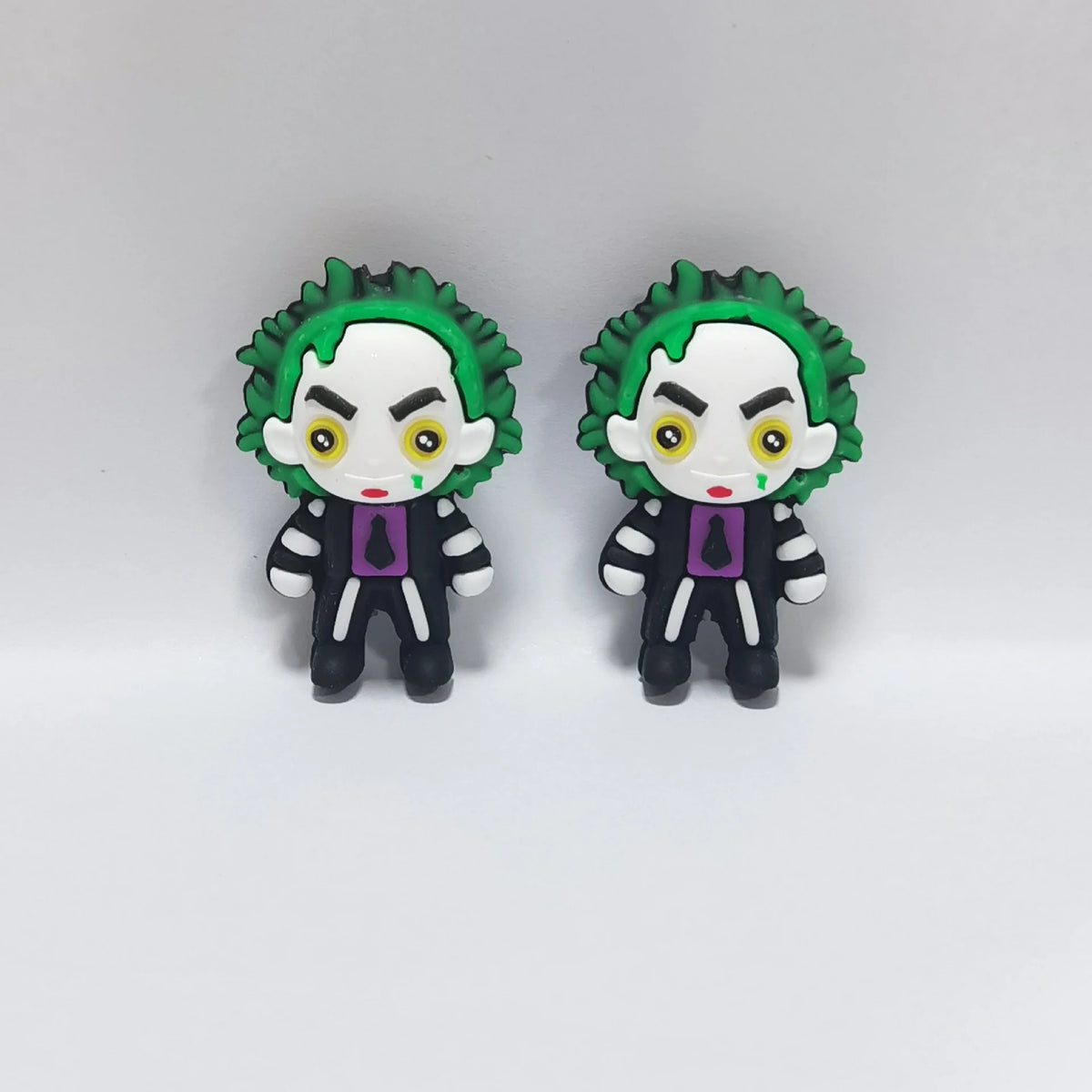 Green-Haired Figure - Striped Suit Halloween silicone focal bead design on a pale background