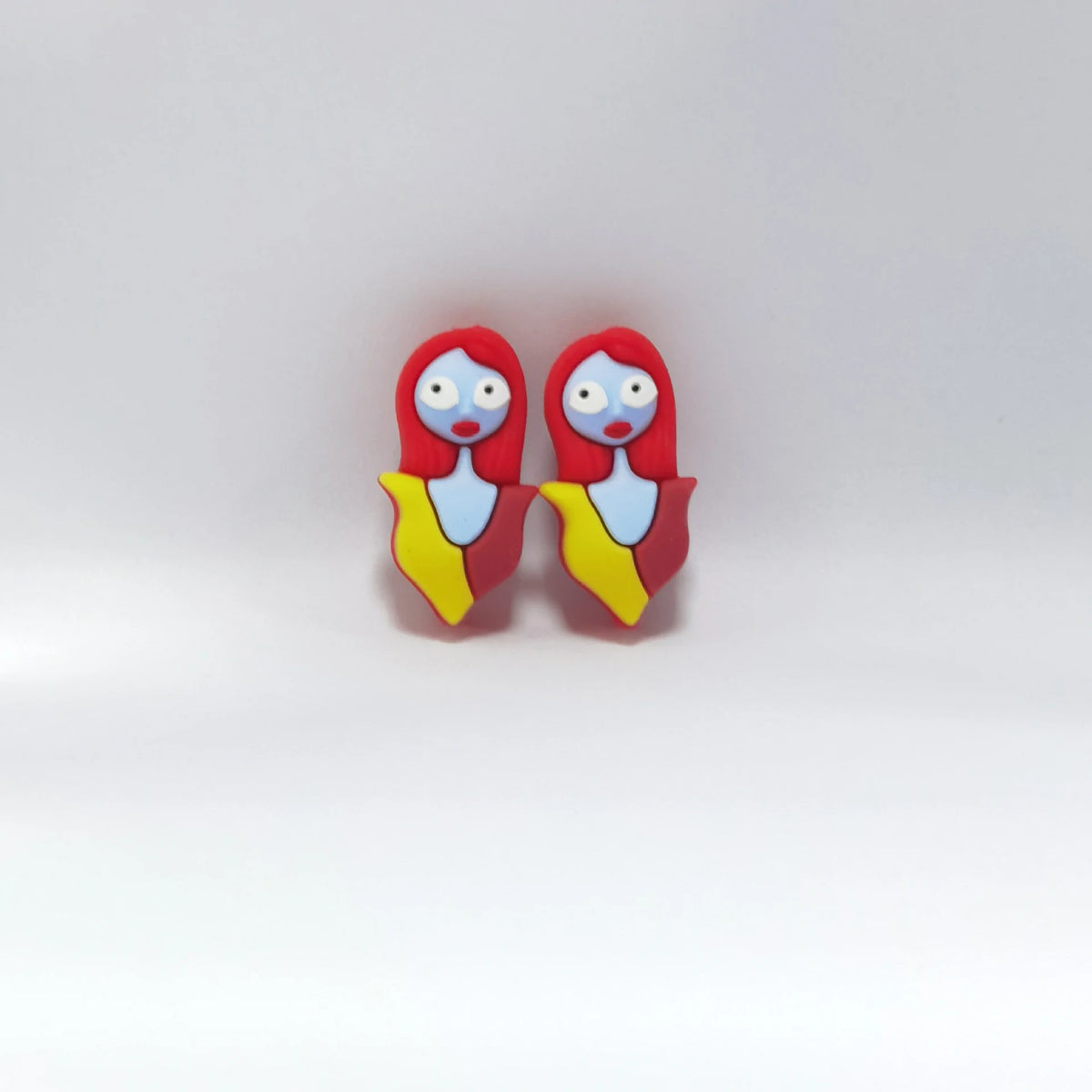 Red-Haired Figure - Yellow Outfit Halloween silicone focal bead design on a pale background