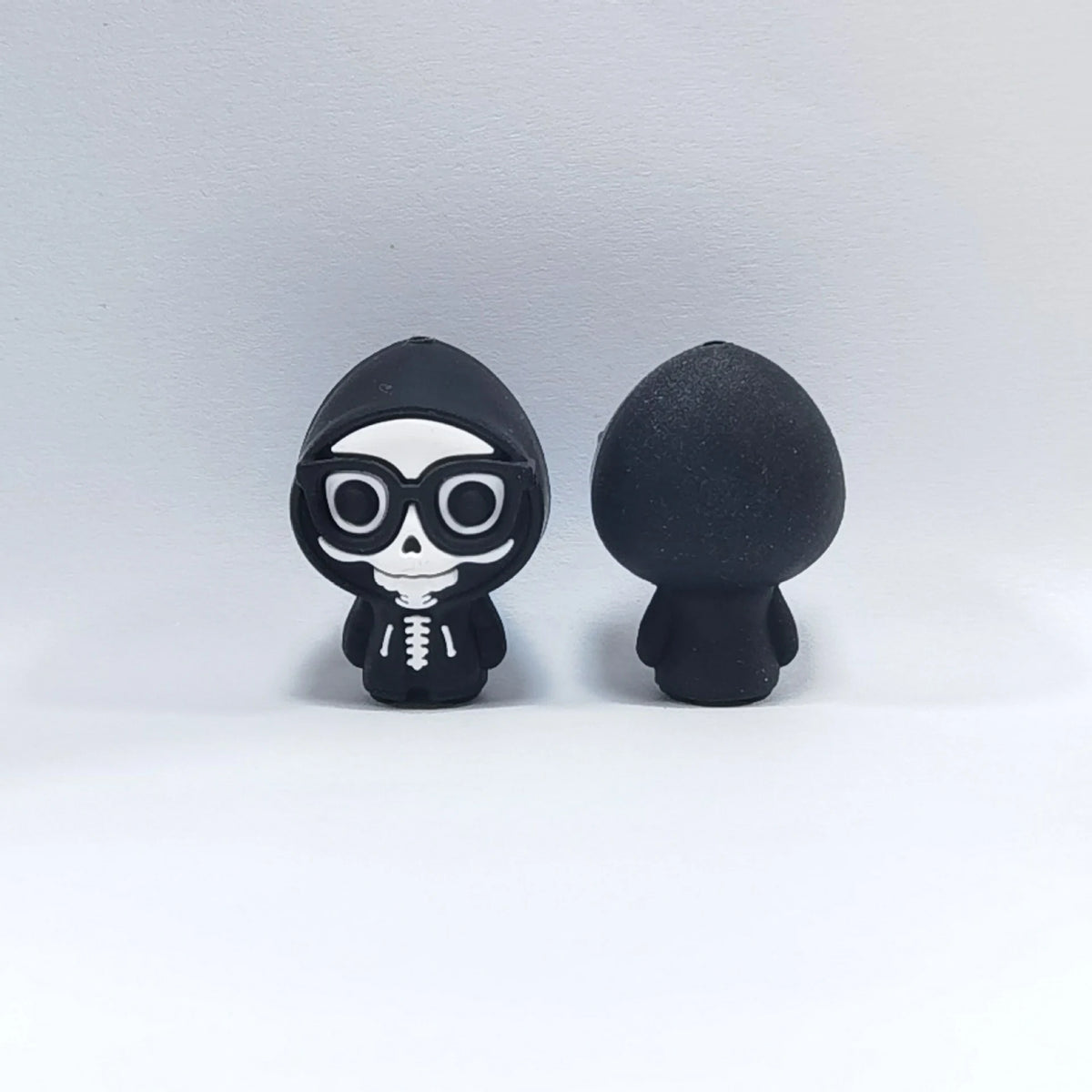 Skeleton - Round Glasses Halloween silicone focal bead design on a pale background