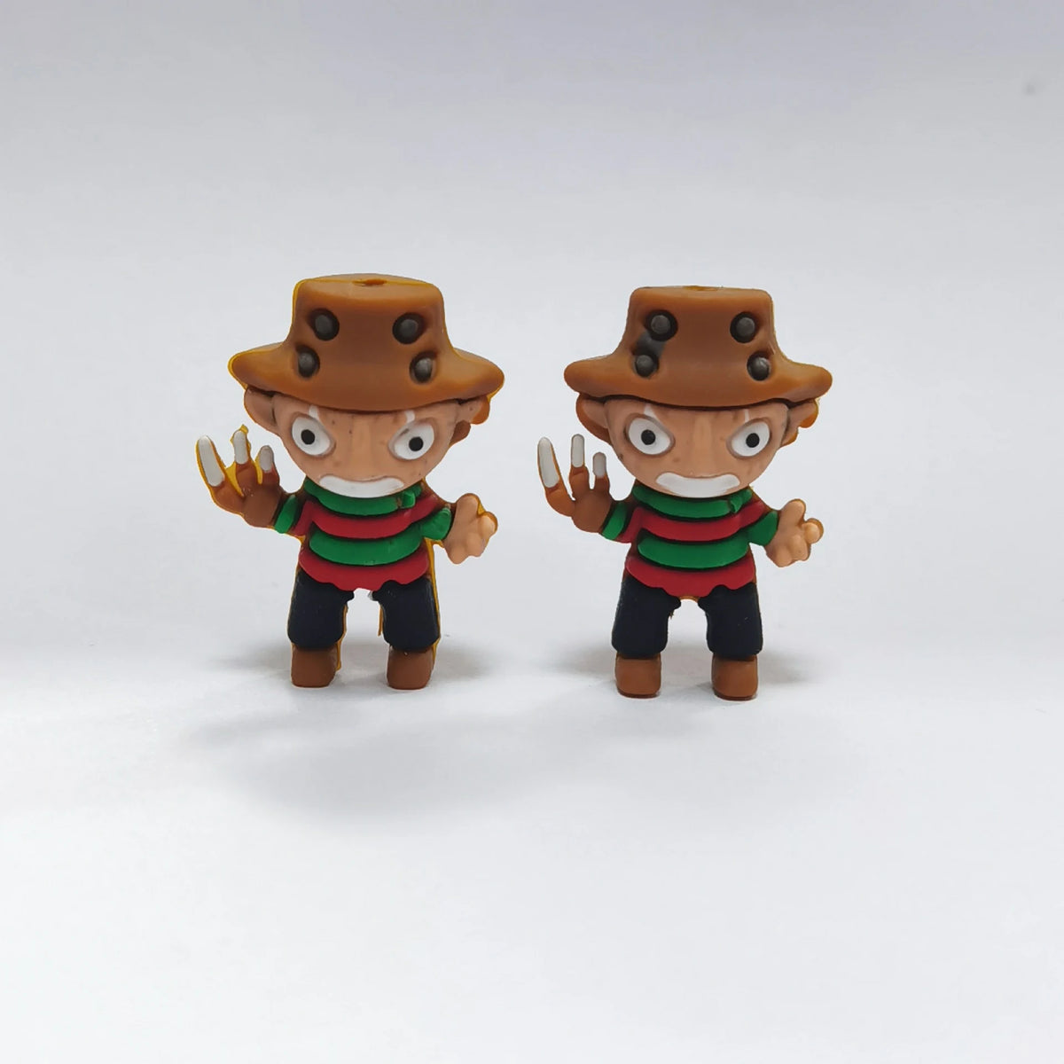 Striped Sweater Figure - Brown Hat Halloween silicone focal bead design on a pale background