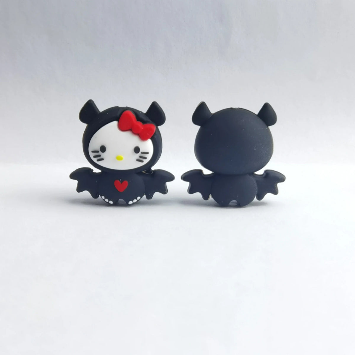 White Cat - Bat Costume Halloween silicone focal bead design on a pale background