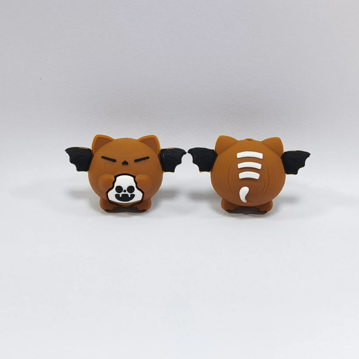 Winged Pumpkin - Brown Halloween silicone focal bead design on a pale background